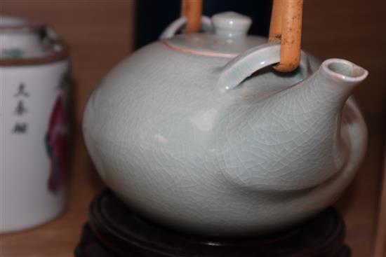 A Chinese famille rose teapot, a yellow glazed bottle vase, and a celadon glazed teapot vase 17cm incl. stand